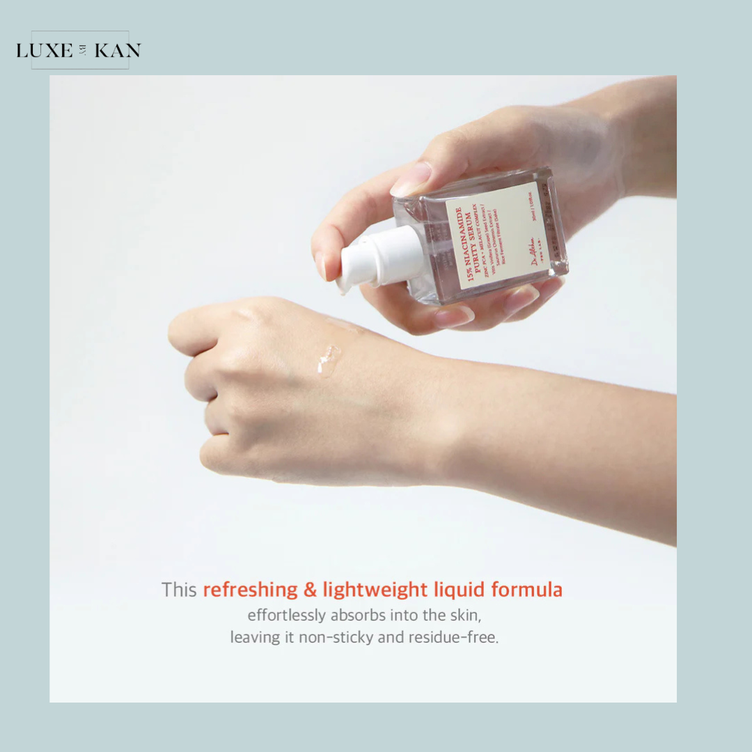 A person dispenses Dr. Althea 15% niacinamide purity serum from a clear, rectangular bottle onto their hand.