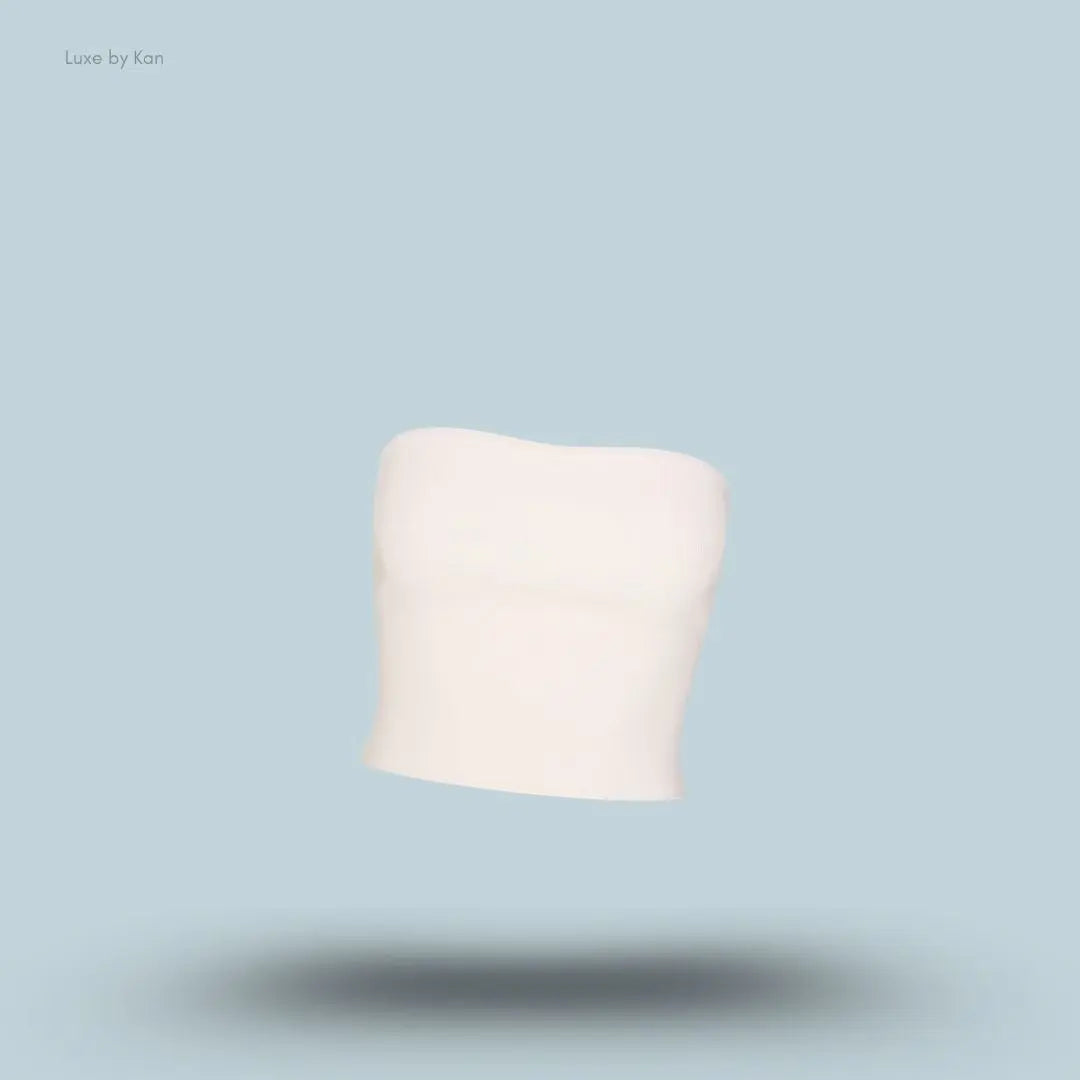 SKIMS Refined Knit Tube Top in Egret, flat lay on light blue background