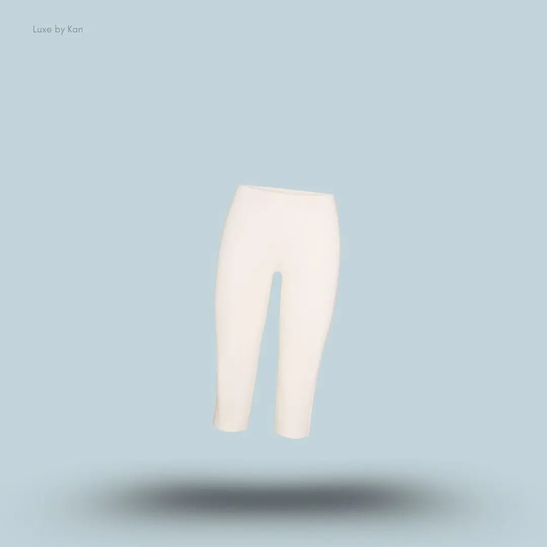 SKIMS Refined Knit Capri in Egret, flat lay on light blue background