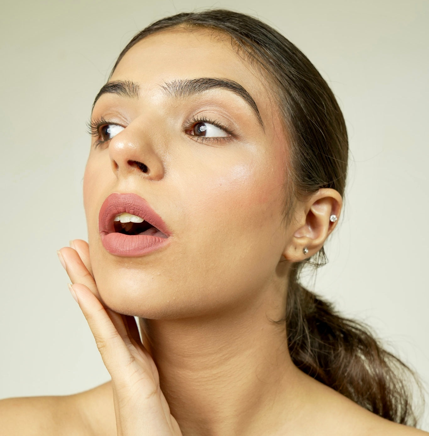 A close-up of a person with era beauty velvet liquid matte lipstick shade.