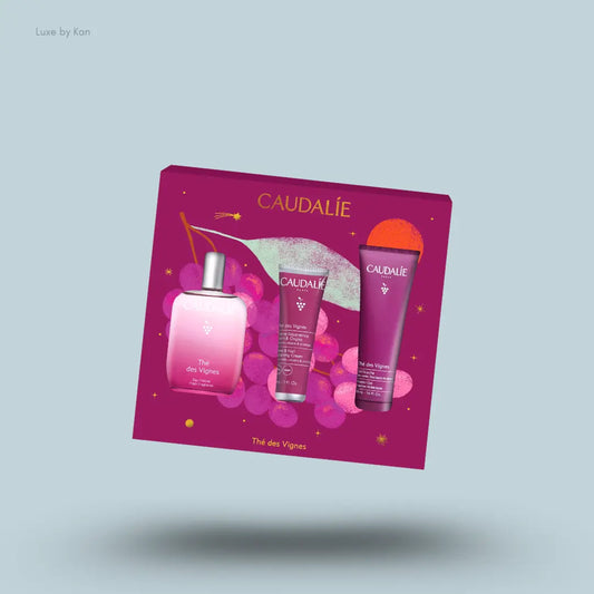 Caudalie Thé des Vignes Fragrance & Body Care Gift Set three products with packaging on blue background
