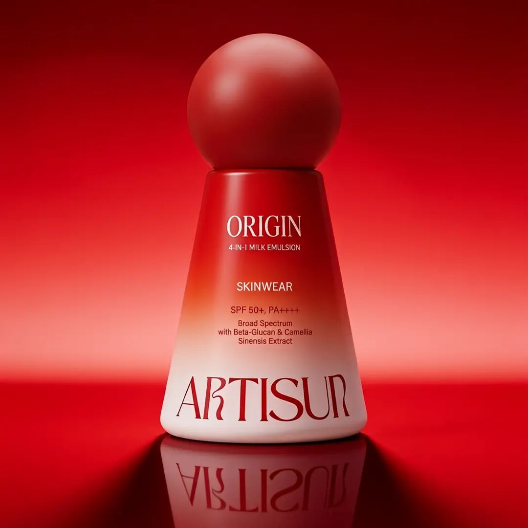 Artisun Origin 4-in-1 Milk Emulsion Sunscreen SPF 50+ bottle on a red background