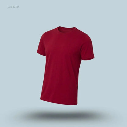 Alo Conquer Reform Crewneck Short Sleeve in Garnet, flat lay on light blue background