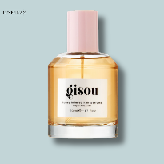 Gisou honey-infused hair perfume in a sleek bottle with a pink cap, offering a 50ml fragrance for lush, scented hair.