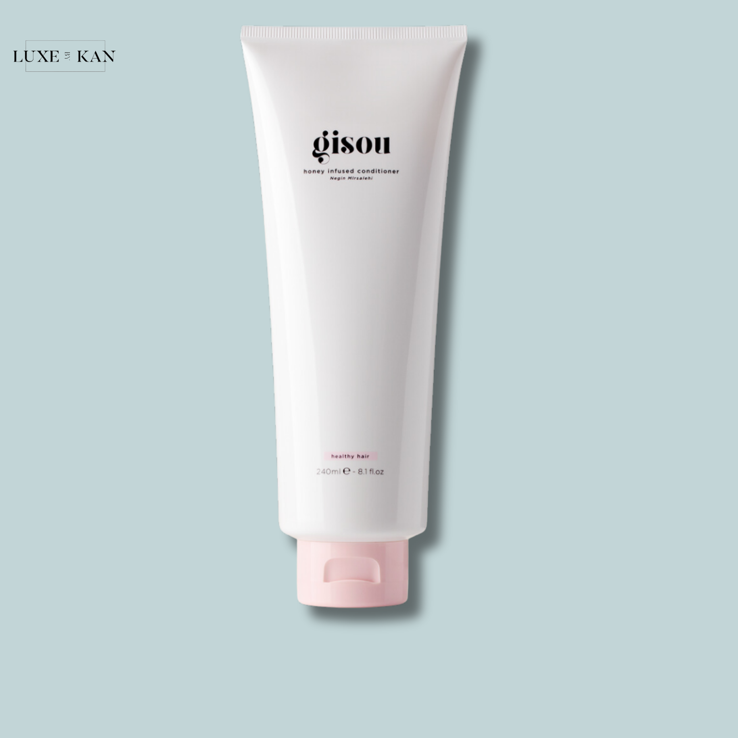 Gisou Honey Infused Conditioner in a sleek white tube.