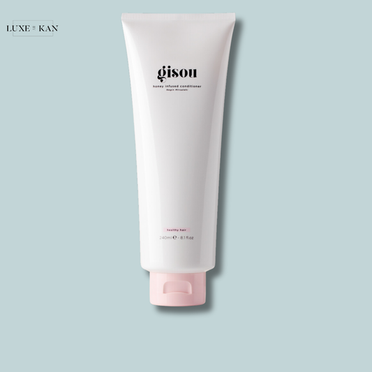 Gisou Honey Infused Conditioner in a sleek white tube.