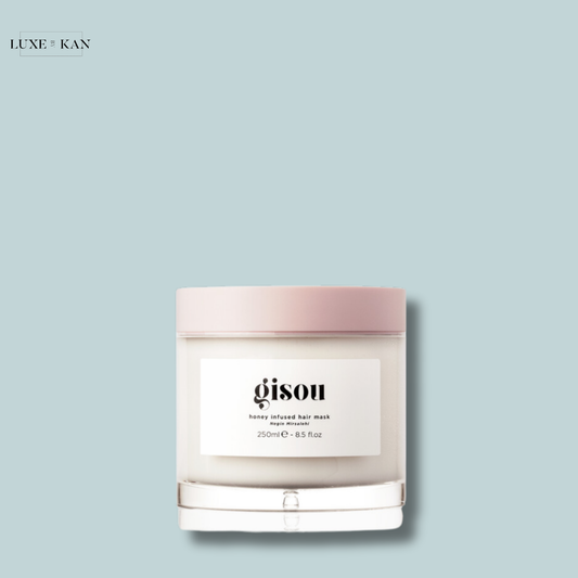 Gisou Honey Infused Hair Mask in a jar with a pink lid.