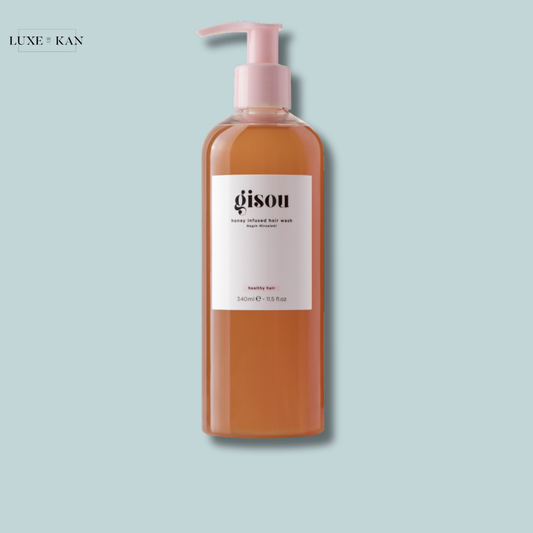 Gisou honey-infused hair wash with a pink pump.
