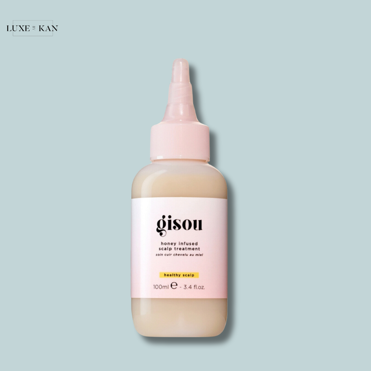 Gisou honey infused scalp treatment bottle, 100ml, with a light pink cap.