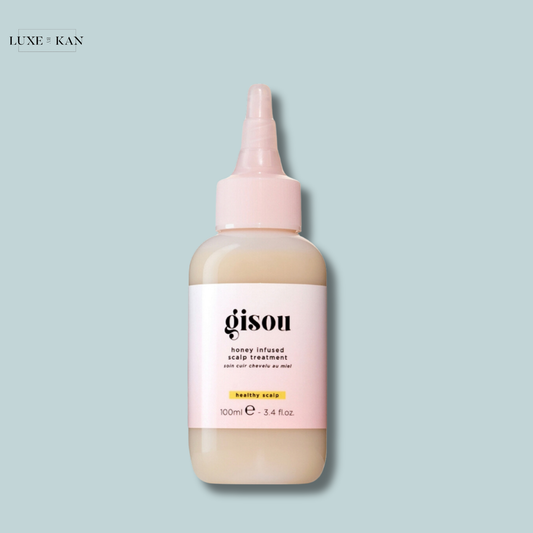 Gisou honey infused scalp treatment bottle, 100ml, with a light pink cap.