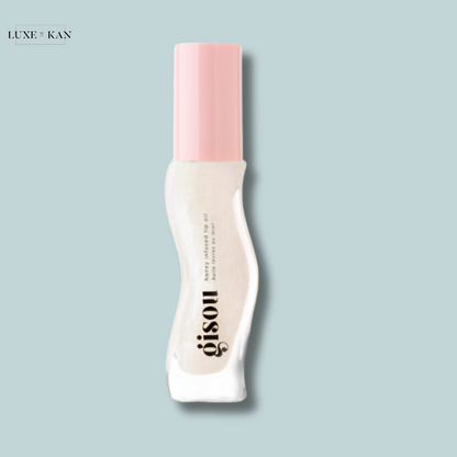 Gisou honey-infused hair oil with a pink cap.