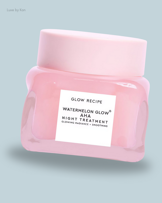 A pink jar of Glow Recipe Watermelon Glow AHA Night Treatment with a white label, promoting glowing skin and smoothing effects.