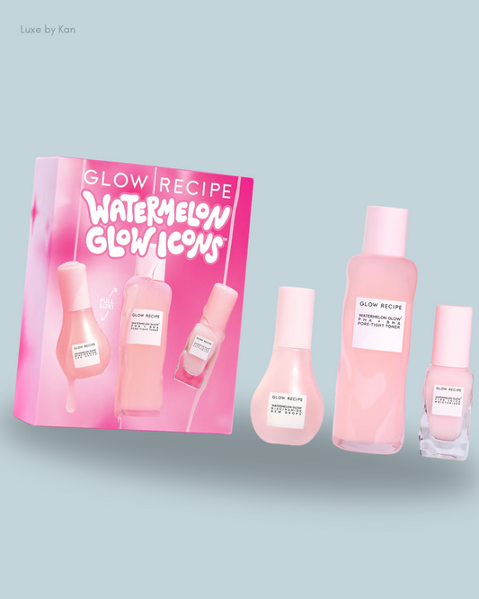 A vibrant beauty box labeled "Glow Recipe Watermelon Glow Icons," featuring three pink skincare products in sleek bottles.