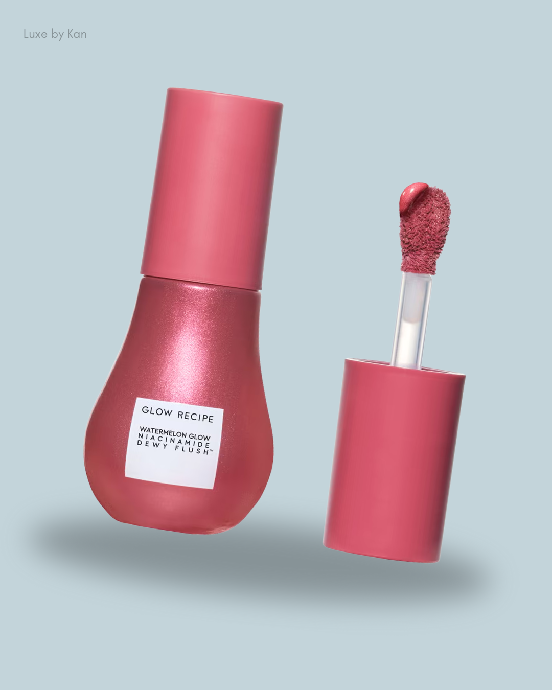 A pink bottle of Glow Recipe's Watermelon Glow Niacinamide Dewy Flush with an applicator featuring a soft blush tip.