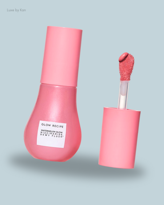 A bottle of Glow Recipe's Watermelon Glow Niacinamide Dewy Flush with a pink cap and applicator.