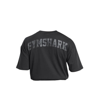 Black Gymshark t-shirt featuring bold "GYMSHARK" logo across the back, designed for comfort and style during workouts.
