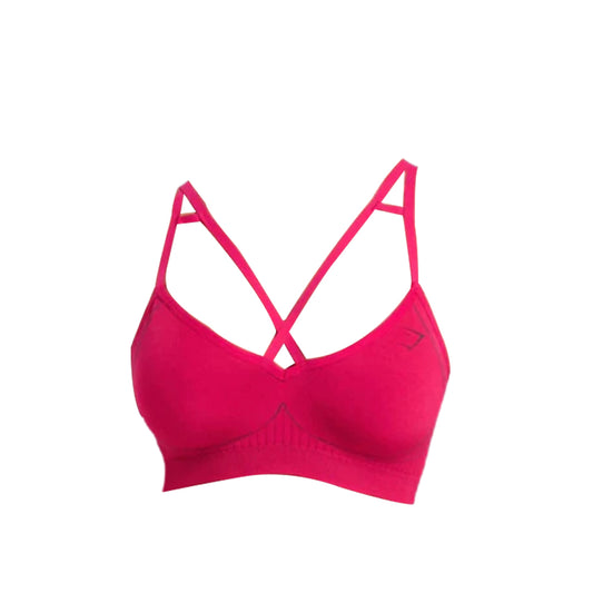 Gymshark bright pink Apex Contrast Sports Bra with cross-back straps and soft fabric, designed for comfort and support during exercise.