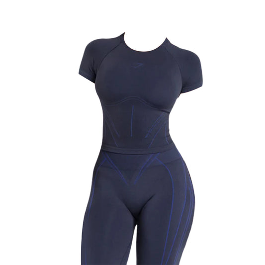 A fitted black athletic outfit featuring an Apex Contrast T-shirt and high-waisted leggings, designed for performance and comfort.