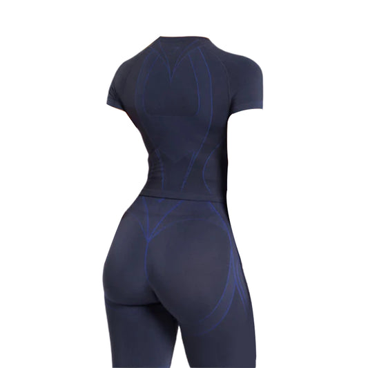 Back view of a fitted black Gymshark athletic outfit with blue accent lines, showcasing a sporty design and emphasizing the curves.
