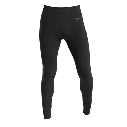 Black Control Baselayer Leggings with a fitted design, featuring a subtle logo.