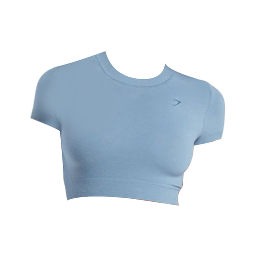 Gymshark cotton seamless crop top in light blue, featuring short sleeves, stretch fit, and ribbed hem for comfort and style.