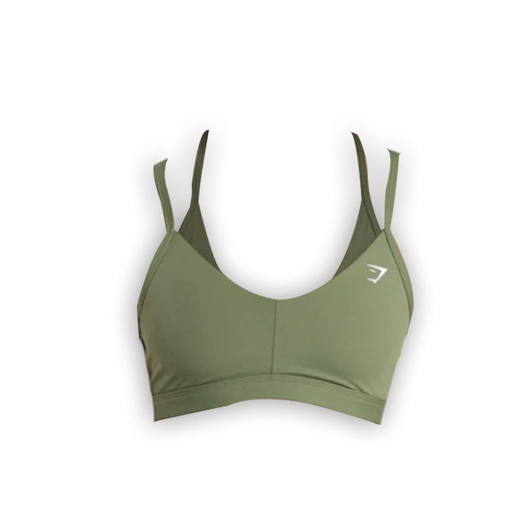 Olive green sports bra with adjustable straps and a logo on the side, designed for comfort and support during workouts.