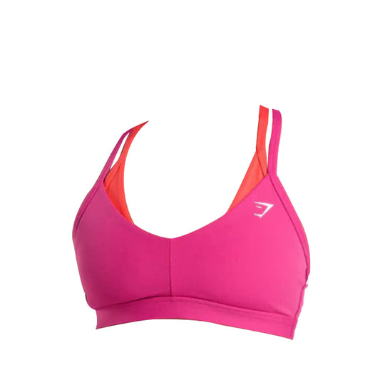 Gymshark double up sports bra with crisscross adjustable straps, featuring an orange inner lining and a white logo on the front.