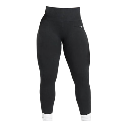 Black Gymshark high-waisted seamless leggings with a white logo on the hip.