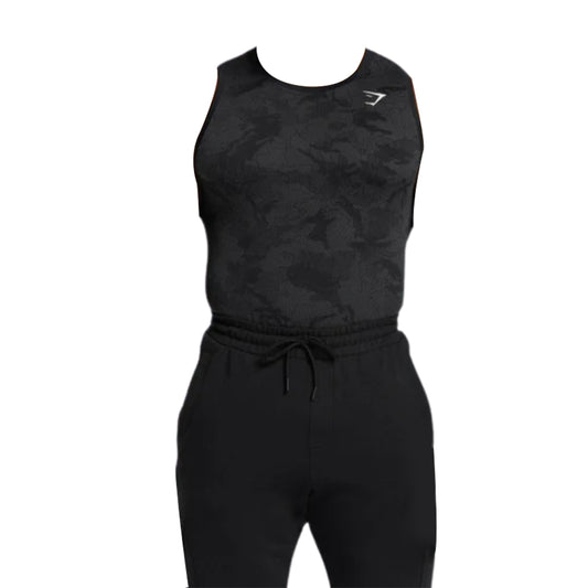 Men’s black sleeveless Gymshark Geo Seamless tank top with a camouflage pattern, paired with drawstring jogger pants, suitable for fitness activities.