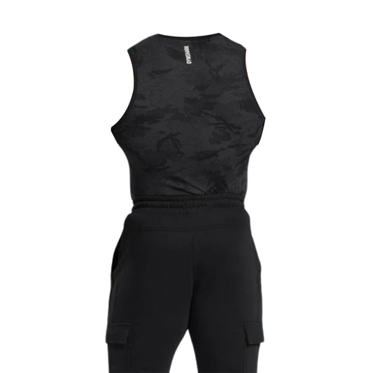 Back view of a black geo seamless tank top with a subtle camouflage pattern, paired with black cargo pants.