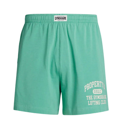 Men's Gymshark lightweight jersey shorts in light green, featuring an elastic waistband with Gymshark logo and "Property of GSLC The Gymshark Lifting Club" printed in white on the left leg.