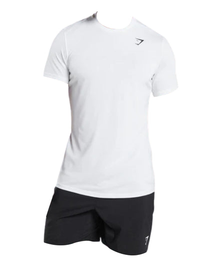 A plain white short-sleeve athletic shirt paired with black shorts, featuring a small logo on the top left side.
