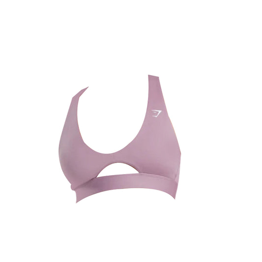 Dusty rose Gymshark sports bra featuring a peek-a-boo cutout between the bust and the straps, with the Gymshark logo appearing in white on the left strap.