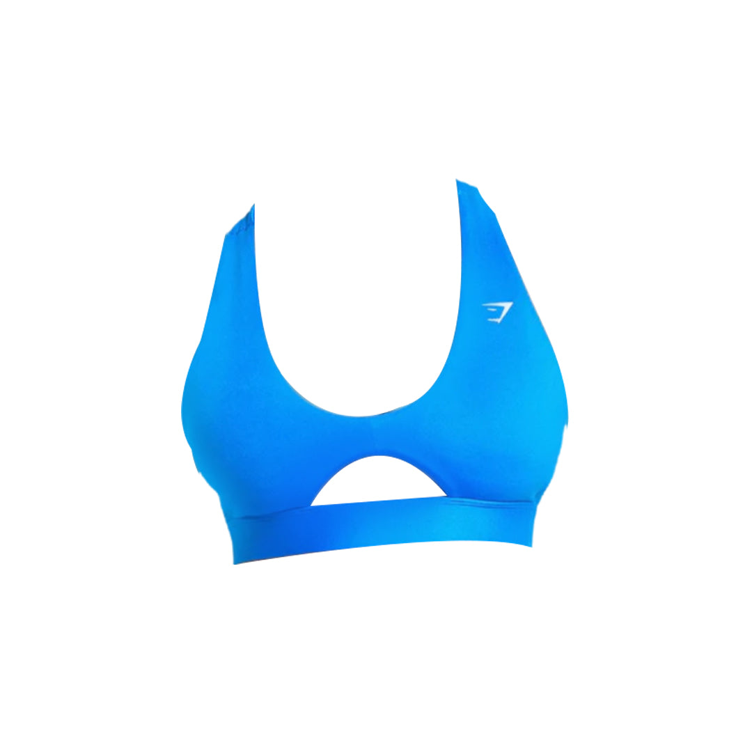 Azure blue sports bra with a scooped neckline and a horizontal cutout detail below the bust, against a white backdrop.