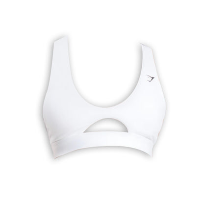 White Gymshark sports bra with cutout, brand logo on the right strap.