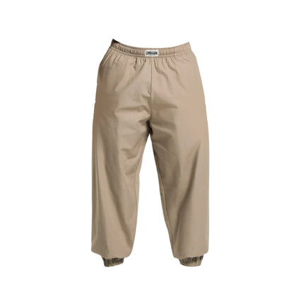 Beige, elastic-waist pants with a relaxed fit and ribbed cuffs, ideal for casual or outdoor wear.