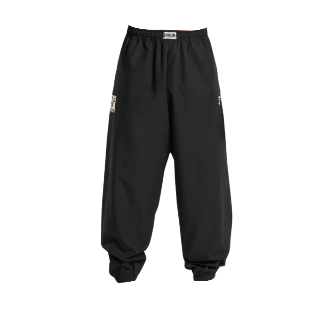 Black, loose-fitting jogger pants featuring a drawstring waist and elastic cuffs, designed for comfort and casual style.