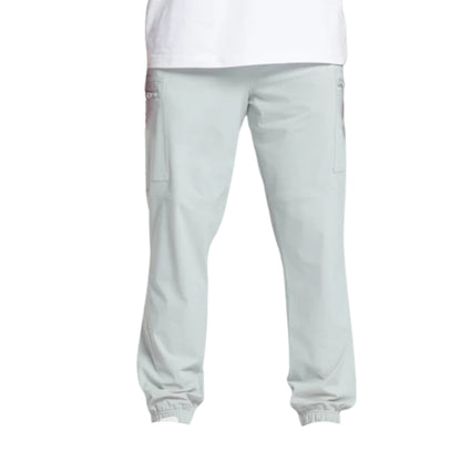 Light gray jogger pants with elastic cuffs and side pockets, paired with a plain white t-shirt.