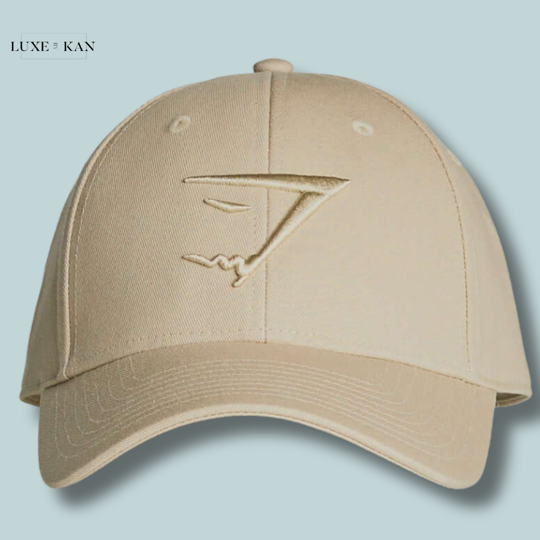 Gymshark Sharkhead Cap featuring an embossed gold logo on the front.