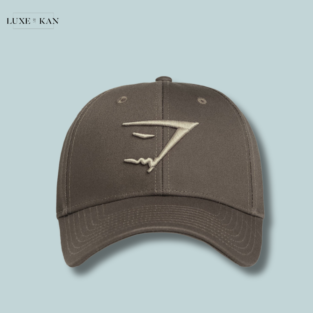Gymshark gray baseball cap featuring a minimalistic embroidered logo on the front.