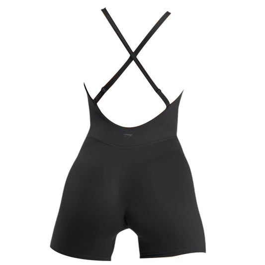 Gymshark Strappy All-in-One black athletic romper with crossback straps, featuring a fitted design and short legs, perfect for workouts or casual wear.