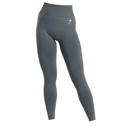 High-waisted, dark gray leggings with textured detailing, ideal for athletic or casual wear. Featuring a subtle logo on the waistband.