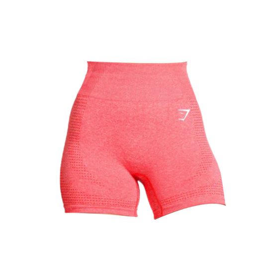 Close-up of seamless coral-colored Gymshark Vital 2.0 shorts with a high waistband and logo on the left leg.