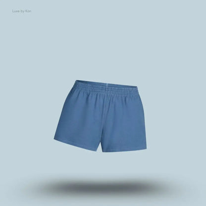 SKIMS Cotton Jersey Loose Short in Harbor, flat lay on light blue background