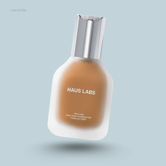 Haus Labs Triclone Skin Tech Medium Coverage Foundation in frosted glass container with silver lid.