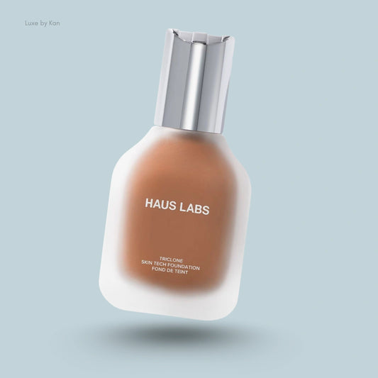 Haus Labs Triclone Skin Tech Foundation bottle with a brushed silver cap and matte glass.