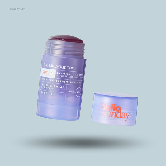 Hello Sunday The Take-Out One Invisible Sunscreen Stick SPF 30, shown open with the product extended and the lid placed beside it.