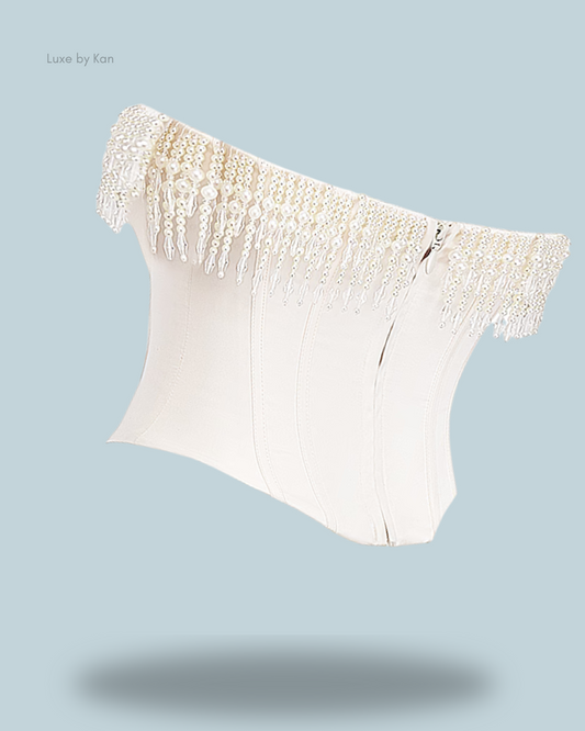 A luxurious Aubrie vintage cream embellished satin corset, adorned with intricate pearl detailing for a refined, elegant look.