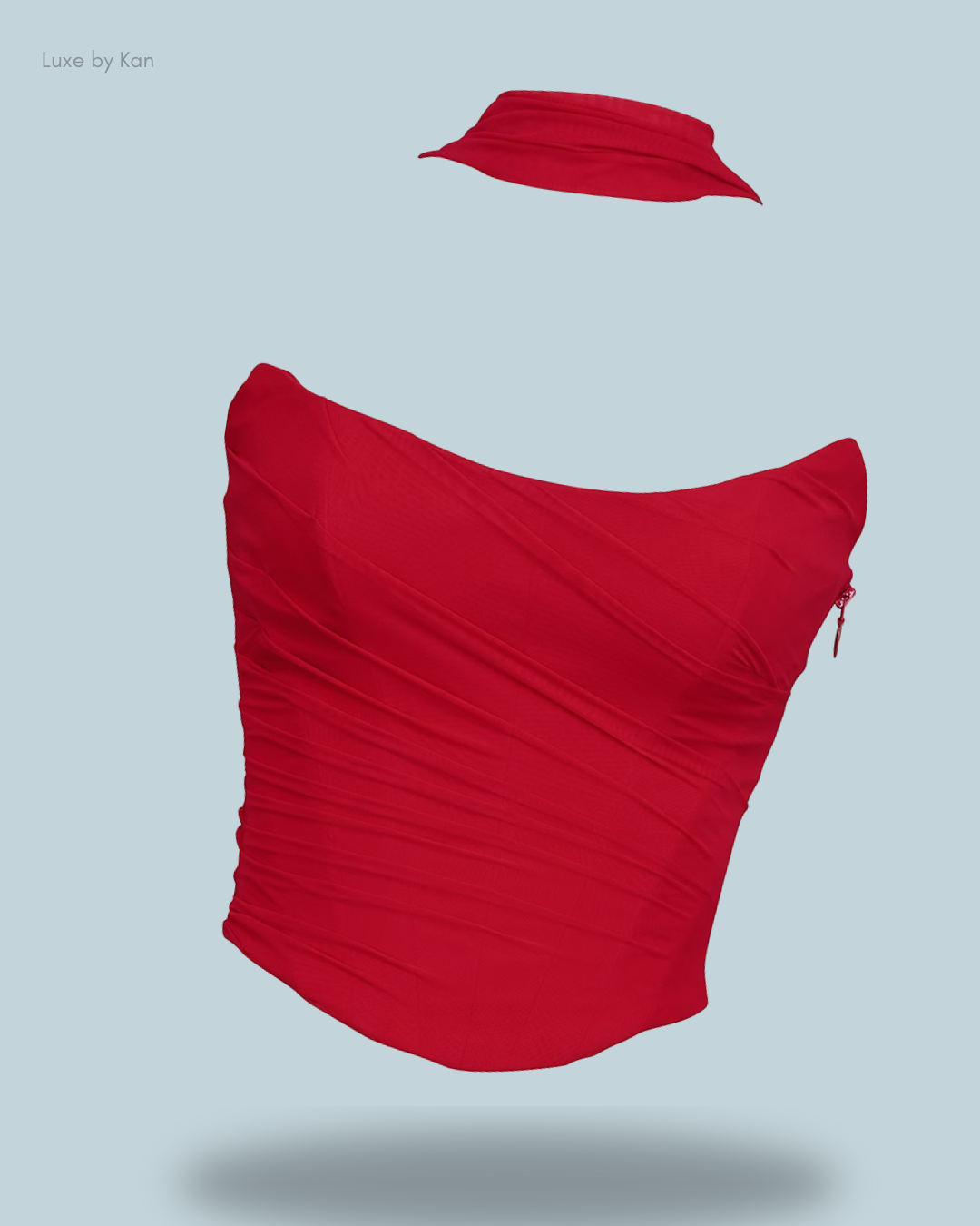 A stylish red House of CB Hallie strapless corset top, featuring a structured fit and a detachable neck scarf for added flair.