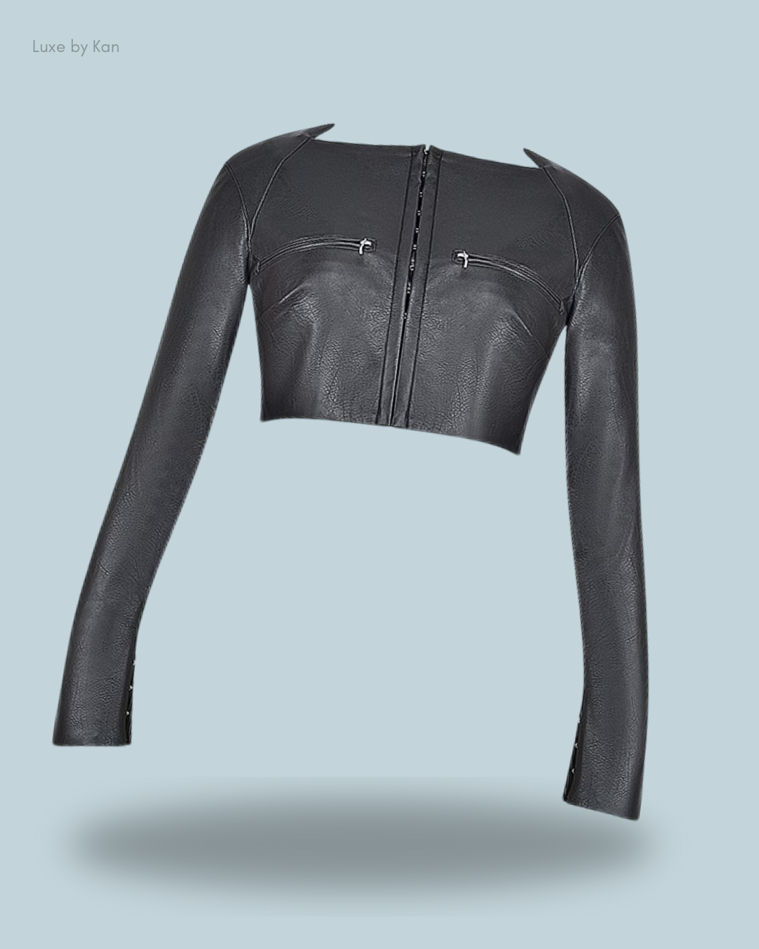 House of CB Ione black vegan leather cropped top with long sleeves, front zipper, and chest zip details.